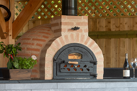 Make the Perfect Slice with a Fuego Wood-Fired Pizza Oven