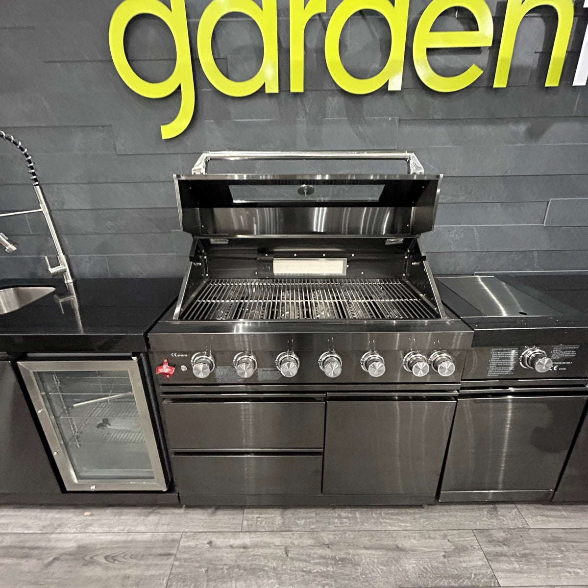 Ex Display Draco Grills 6 Burner Black Stainless Steel Outdoor Kitchen with Sear Station, Sink and Fridge Unit and Double Cupboard