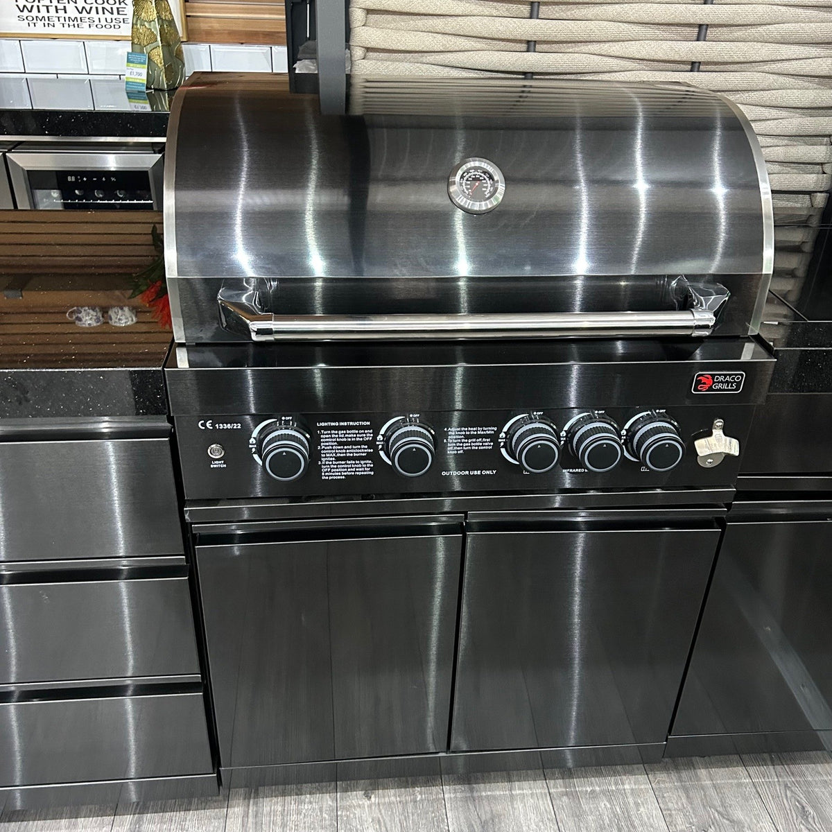 Ex Display Draco Grills 4 Burner Black Stainless Steel Outdoor Kitchen with Sear Station, 3 Drawer Unit and Mid Height Unit with Single Fridge