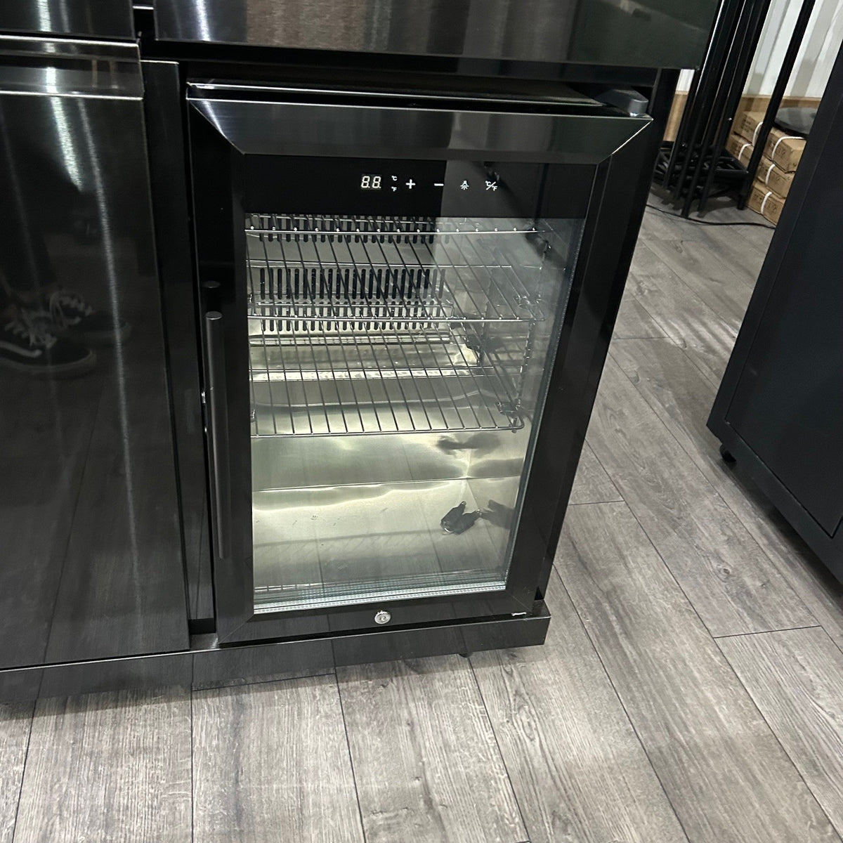 Ex Display Draco Grills 4 Burner Black Stainless Steel Outdoor Kitchen with Sear Station, 3 Drawer Unit and Mid Height Unit with Single Fridge