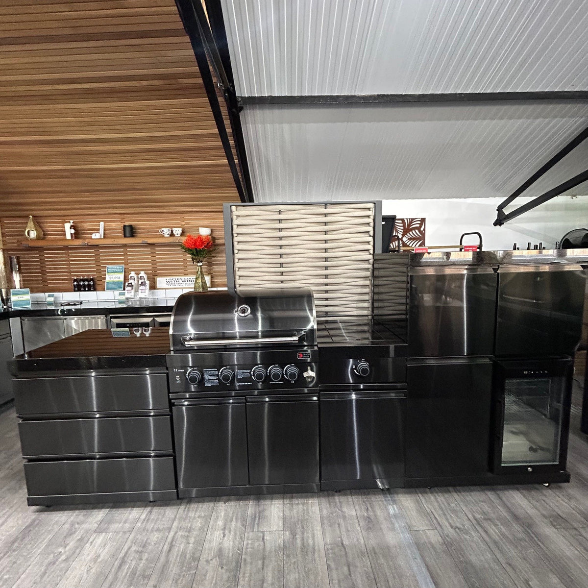 Ex Display Draco Grills 4 Burner Black Stainless Steel Outdoor Kitchen with Sear Station, 3 Drawer Unit and Mid Height Unit with Single Fridge