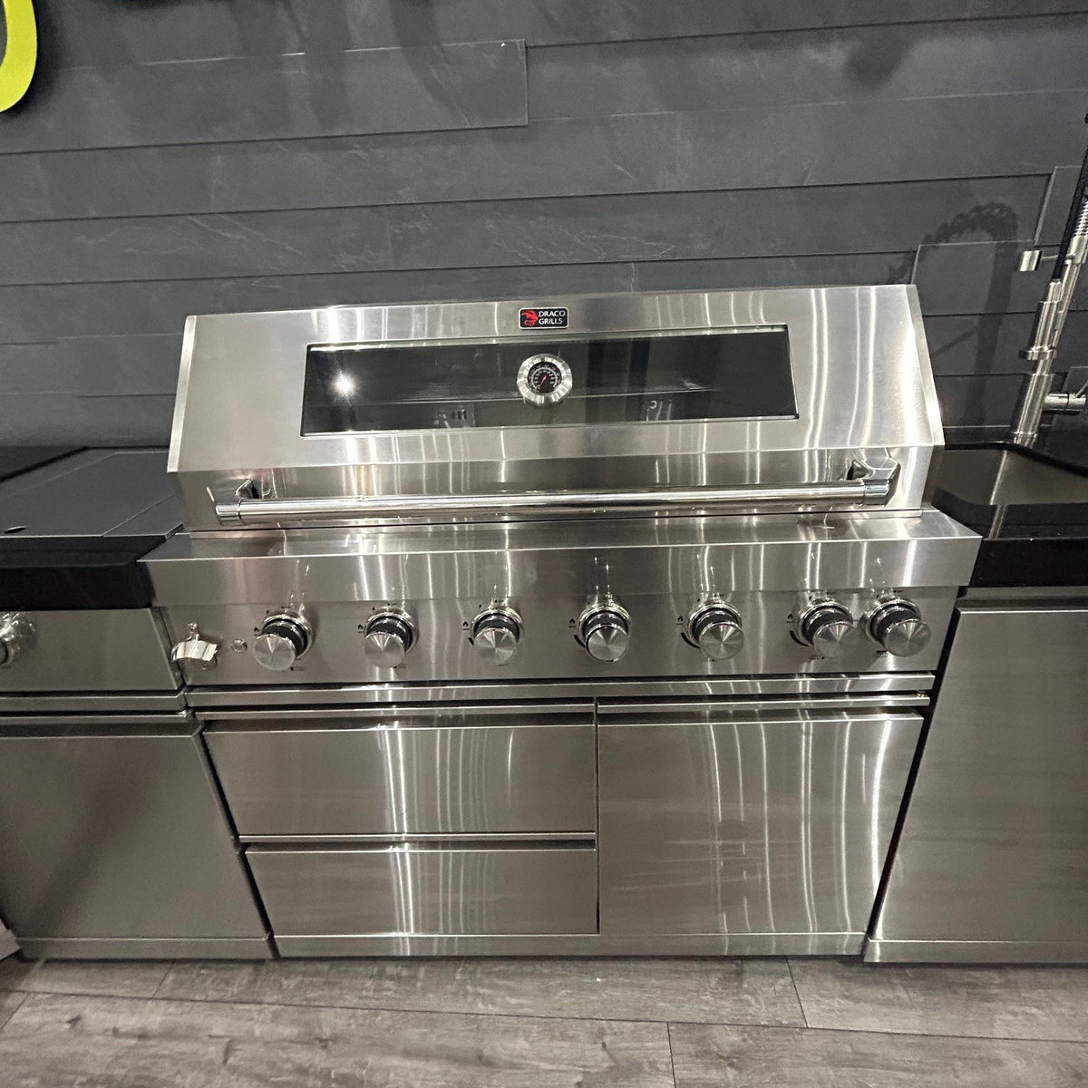 Ex Display Draco Grills 6 Burner Stainless Steel Outdoor Kitchen with Sear Station, 90 Degree Corner, Double Cupboard and Sink and Fridge Unit