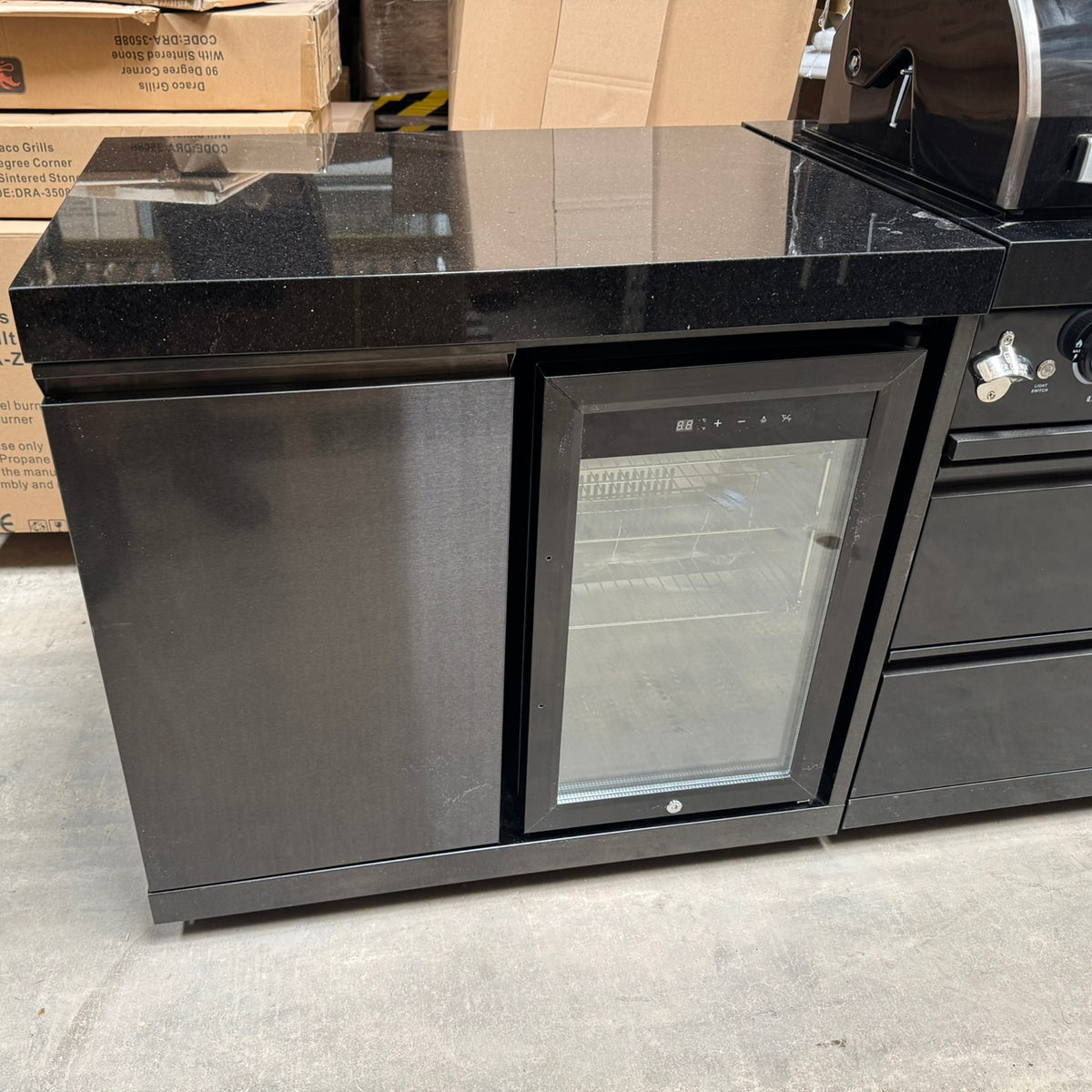 Ex Display Draco Grills 6 Burner BBQ Black Stainless Steel Modular Outdoor Kitchen with Sear Station, Double Cupboard and Fridge Unit