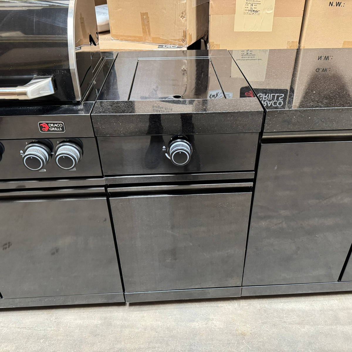 Ex Display Draco Grills 6 Burner BBQ Black Stainless Steel Modular Outdoor Kitchen with Sear Station, Double Cupboard and Fridge Unit
