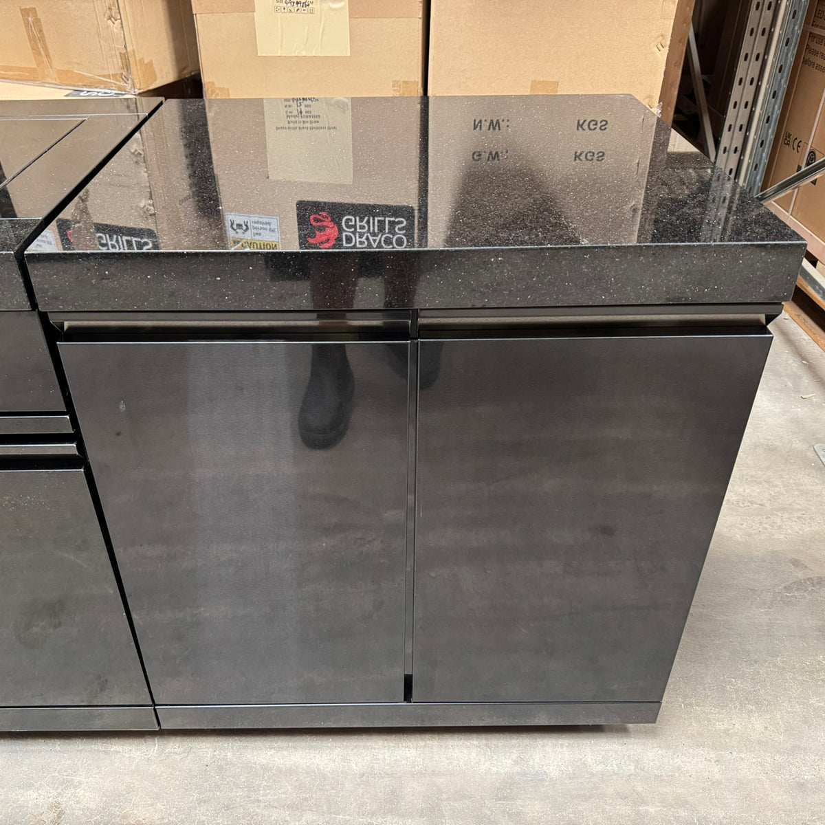 Ex Display Draco Grills 6 Burner BBQ Black Stainless Steel Modular Outdoor Kitchen with Sear Station, Double Cupboard and Fridge Unit