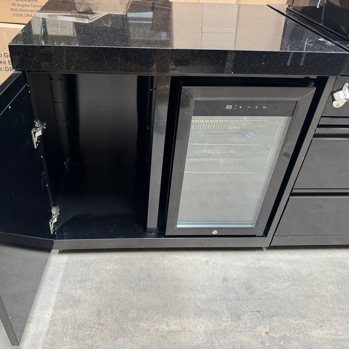 Ex Display Draco Grills 6 Burner BBQ Black Stainless Steel Modular Outdoor Kitchen with Sear Station, Double Cupboard and Fridge Unit